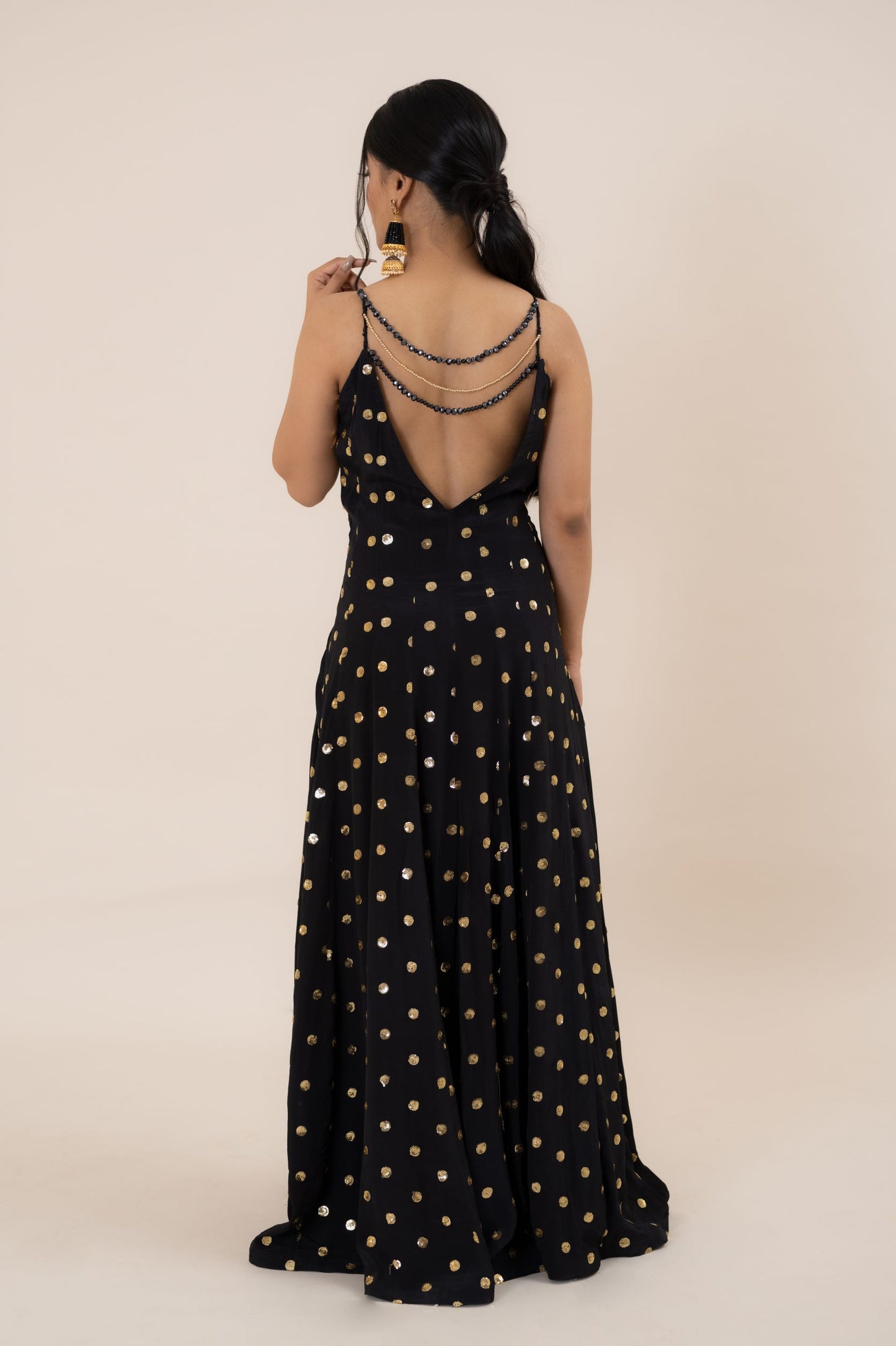 When it comes to fusion style with comfort and tradition, nothing can beat the serenity and beauty of this black one piece dress. This Midnight Black Crepe Embroidered set is an alluring outfit that will surely make you stand out in the wedding crowd. With an exquisite play of dreamy embroidery and a dazzling design, this black dress party wear is a perfect pick for cocktail and reception functions.