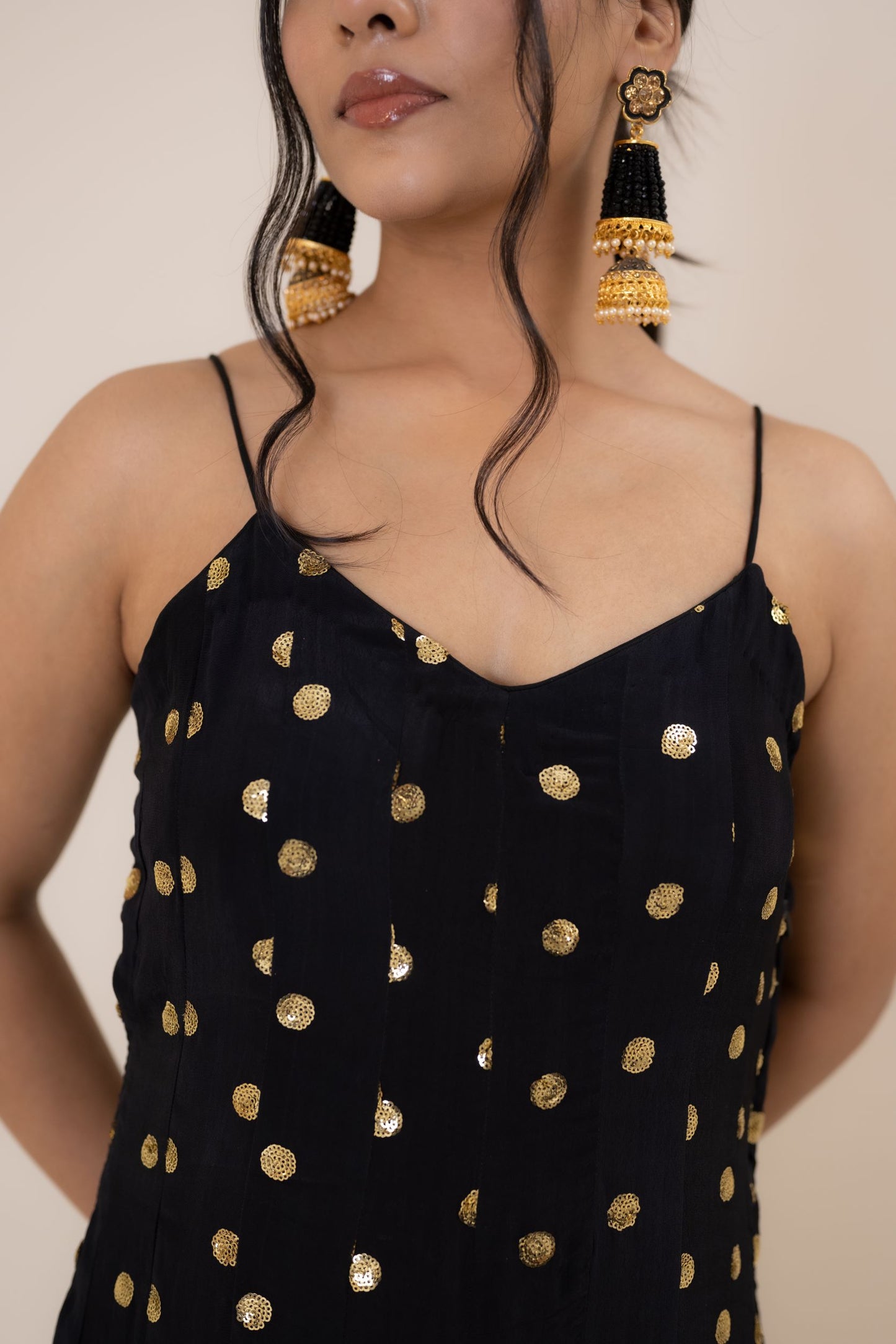 When it comes to fusion style with comfort and tradition, nothing can beat the serenity and beauty of this black one piece dress. This Midnight Black Crepe Embroidered set is an alluring outfit that will surely make you stand out in the wedding crowd. With an exquisite play of dreamy embroidery and a dazzling design, this black dress party wear is a perfect pick for cocktail and reception functions.