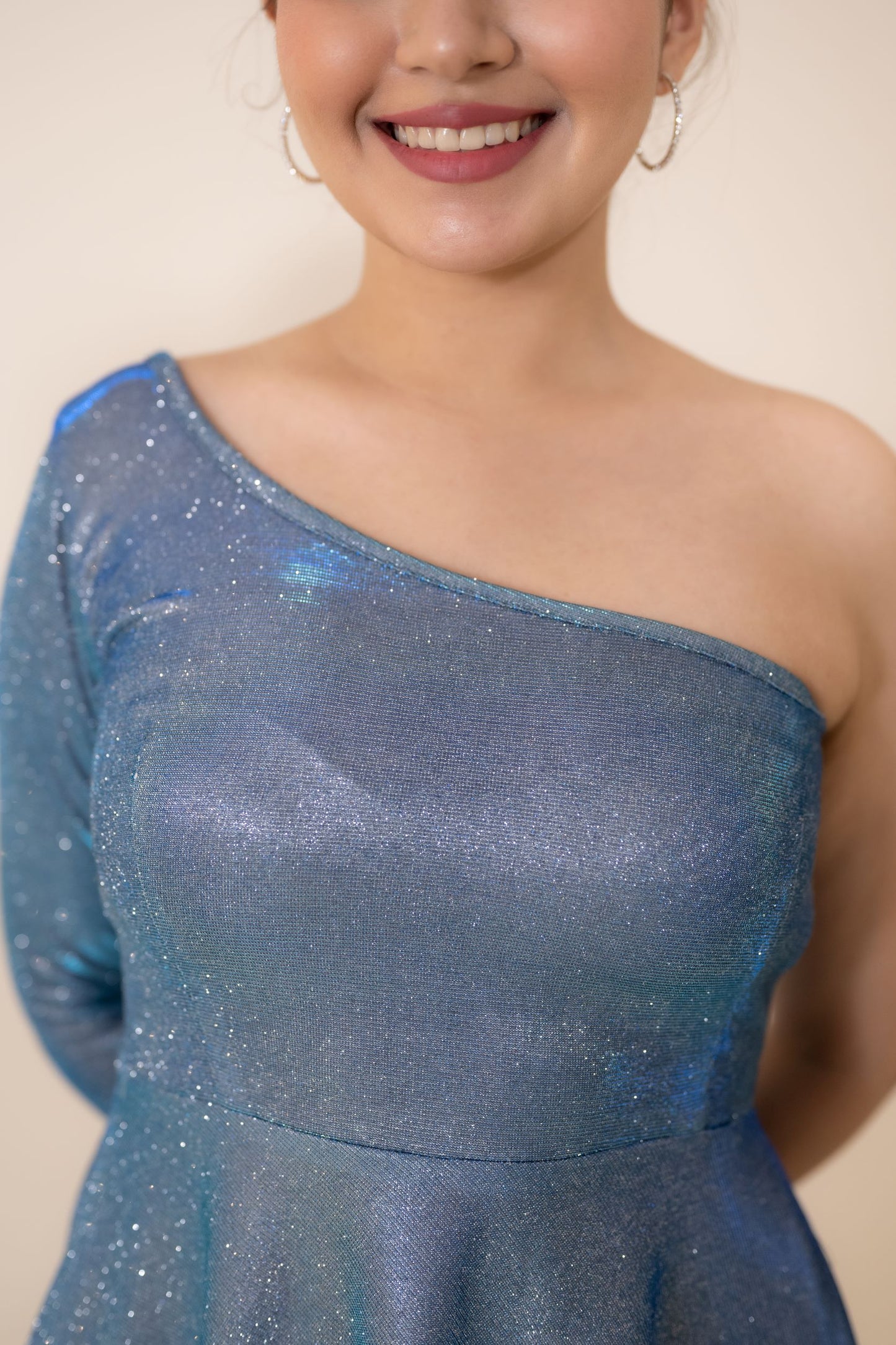 This Blue Sparkly dress is an off shoulder one piece short dress which shines bright like a diamond and stands out against the crowd. The Electric blue dress is a perfect short dress for party which is super comfortable and makes you look classy and foxy.