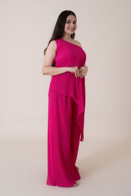 The feminine elegance and drama of this dress is beautifully highlighted when you walk in the room wearing this foxy outfit. This Tunic Set is made up of  luxury pleated gerogette having an off shoulder beautifully sliced top.